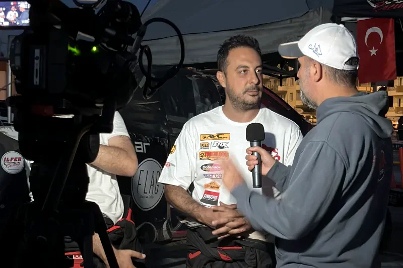 Atilla Baybara giving a trackside interview after a stage